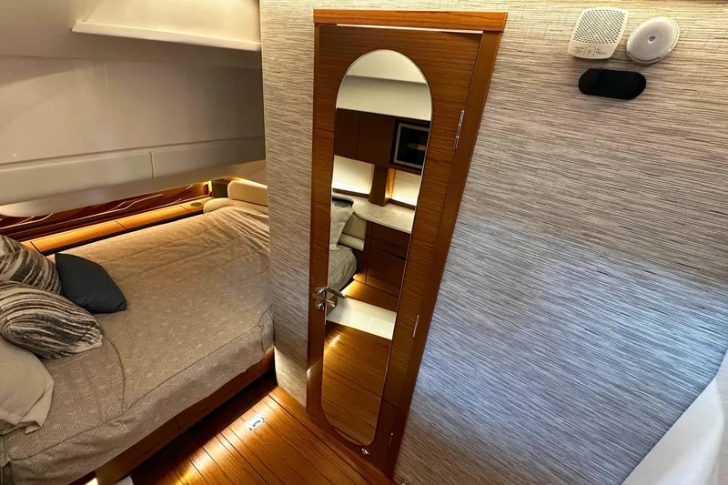 Slide: The Image of Luxurious interior of 2026 Tiara Yachts 39 LS, featuring a cozy bedroom and elegant wood finishes. - 35