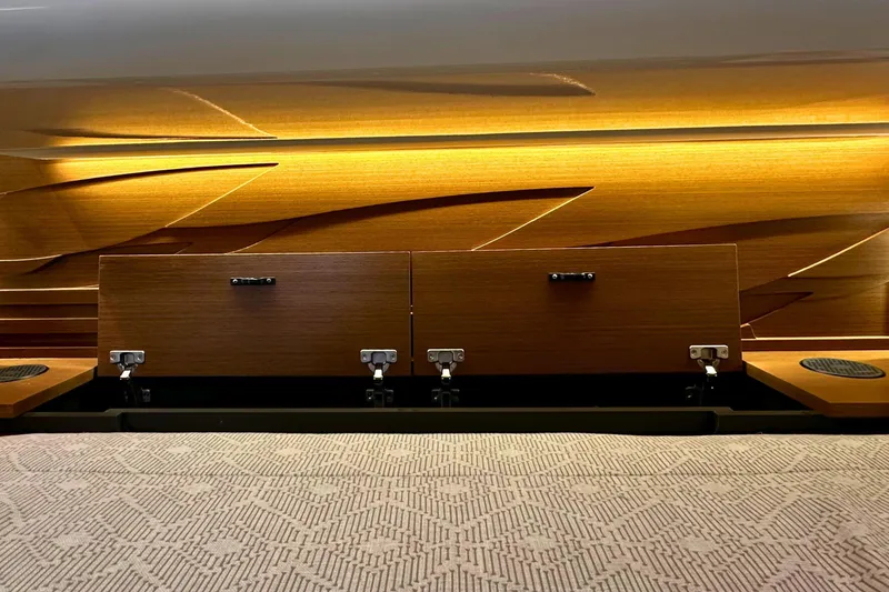 Slide: The Image of Interior of 2026 Tiara Yachts 39 LS, featuring elegant wood paneling and ambient lighting. - 39