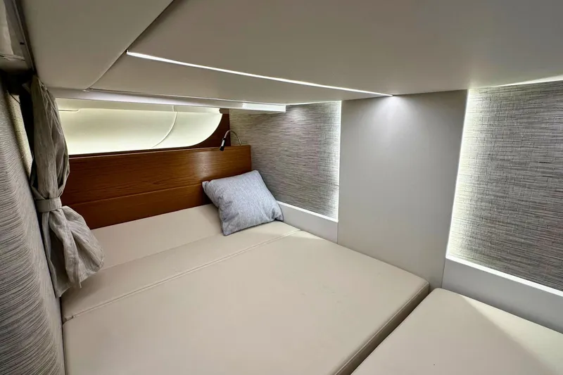 Slide: The Image of Luxurious cabin interior of 2026 Tiara Yachts 39 LS with modern design and cozy bedding. - 41