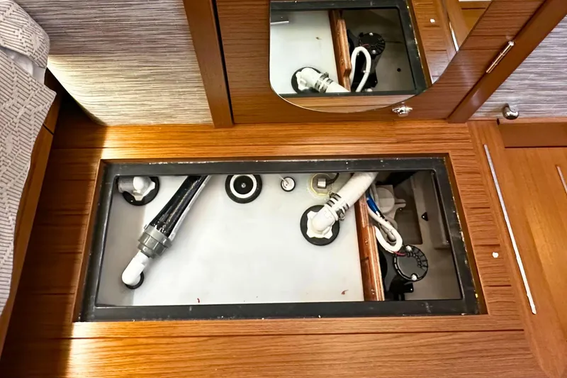 Slide: The Image of Tiara Yachts 39 LS 2026 interior showing underfloor storage and plumbing components. - 45