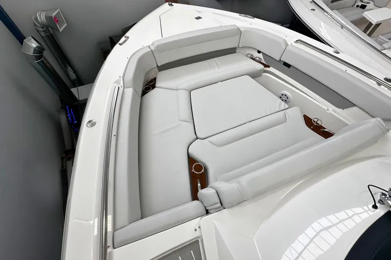 Slide: The Image of 2026 Tiara Yachts 39 LS boat interior with luxurious seating and cup holders. - 49