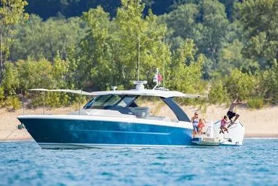 Slide: The Image of 2026 Tiara Yachts 39 LS boat utility compartment with hose and control panel. - 5