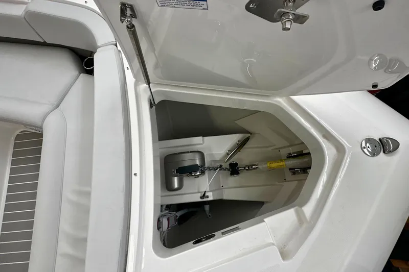 Slide: The Image of 2026 Tiara Yachts 39 LS anchor compartment with open hatch and seating area. - 51