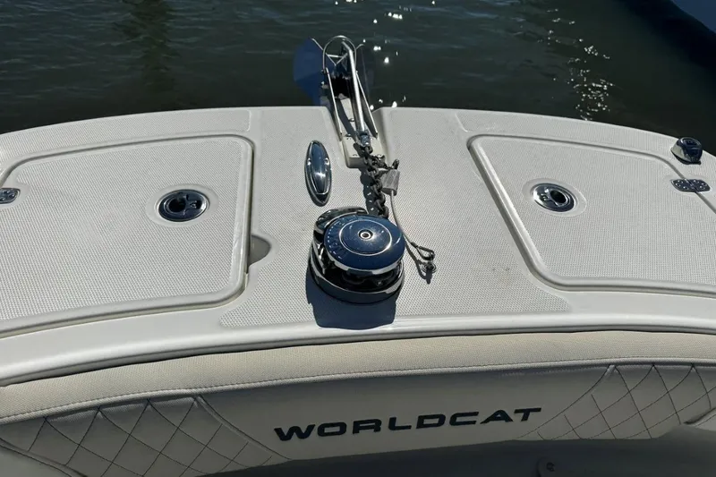Slide: The Image of 2026 World Cat 235 TE boat deck with anchor and storage compartments. - 13