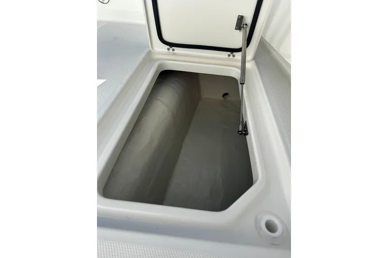Slide: The Image of Open storage compartment on 2026 World Cat 235 TE boat. - 10