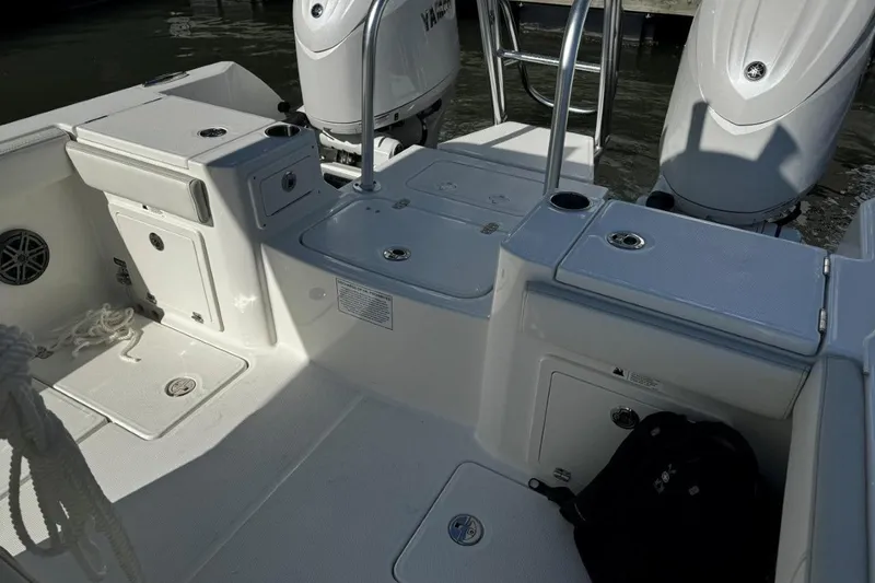 Slide: The Image of 2026 World Cat 235 TE boat interior with dual Yamaha engines and storage compartments. - 6