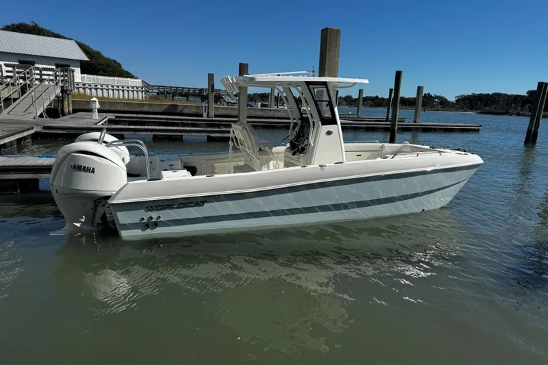 The Image of 2026 World Cat 235 TE boat docked, featuring Yamaha outboard motor. - 0