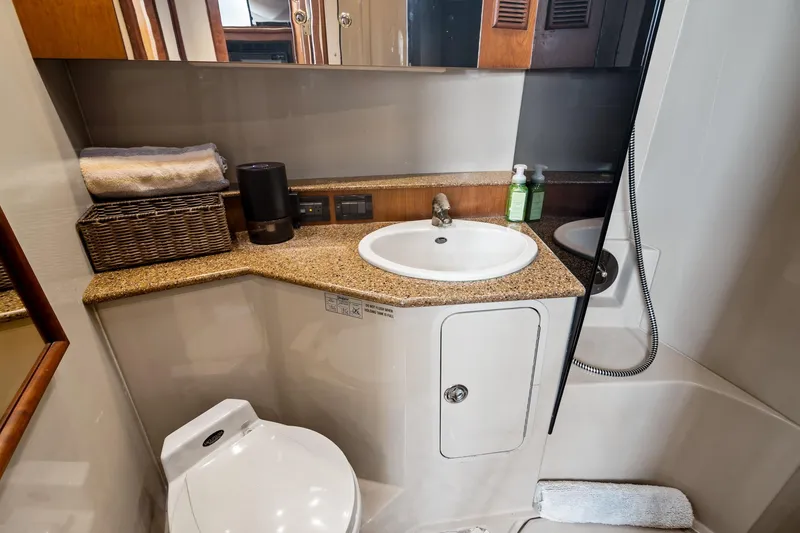 Slide: The Image of Luxurious bathroom in 2001 Rampage 38 Express yacht with sink, toilet, and shower. - 16