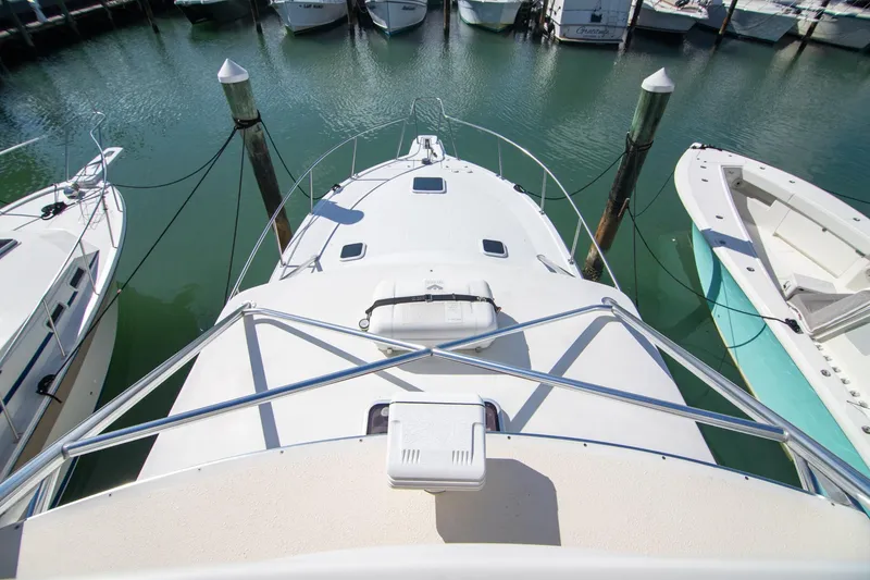 Slide: The Image of 2001 Rampage 38 Express boat docked at marina, aerial view. - 22