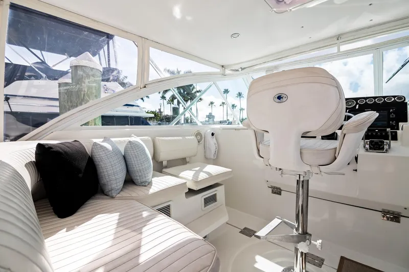 Slide: The Image of Luxurious interior of 2001 Rampage 38 Express yacht with plush seating and helm. - 4