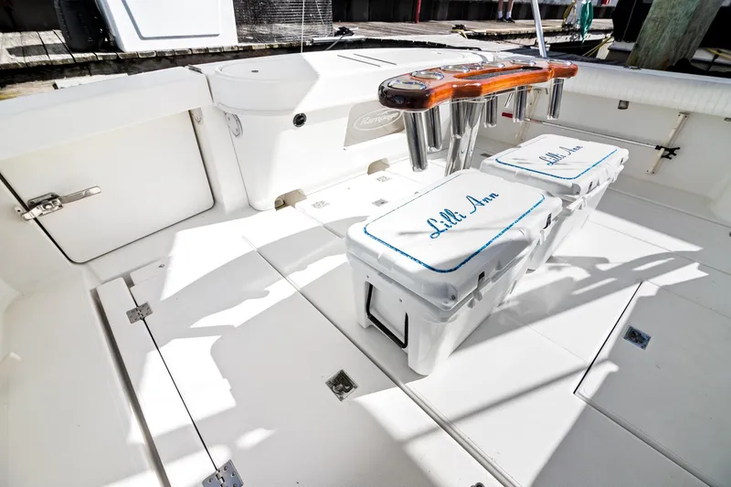 Slide: The Image of 2001 Rampage 38 Express boat deck with storage and seating, featuring "Lilli Ann" branding. - 7