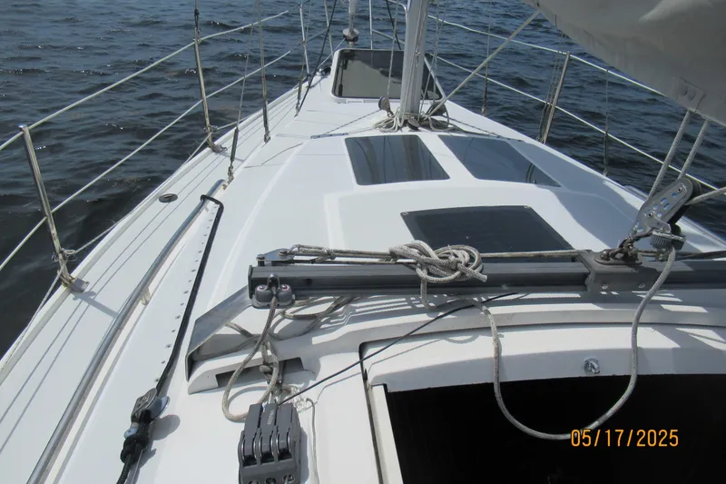 Slide: The Image of Sailing on a 1995 Catalina 270 yacht, deck view with rigging and ocean backdrop. - 11