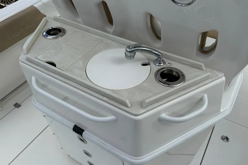 Slide: The Image of Edgewater 262CC 2018 boat sink and countertop with cup holders. - 13