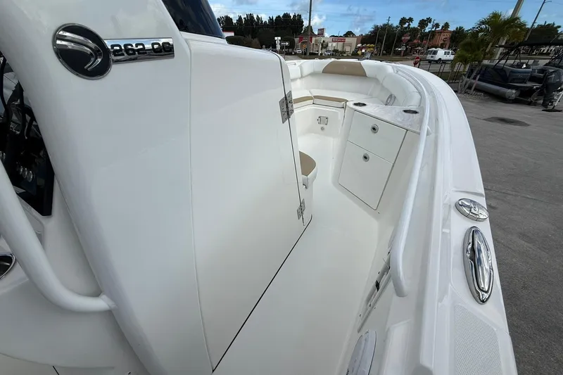 Slide: The Image of 2018 Edgewater 262CC boat interior with seating and storage compartments. - 23