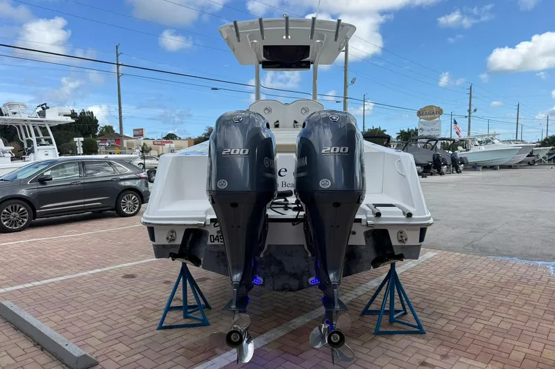 Slide: The Image of 2018 Edgewater 262CC boat with dual Yamaha 200 engines on display. - 3