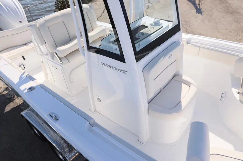 Slide: The Image of 2026 Sea Hunt Ultra 245 SE boat interior with seating and console. - 12