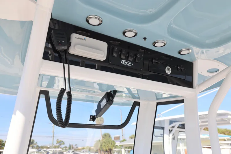 Slide: The Image of 2026 Sea Hunt Ultra 245 SE boat console with Garmin electronics and communication equipment. - 17