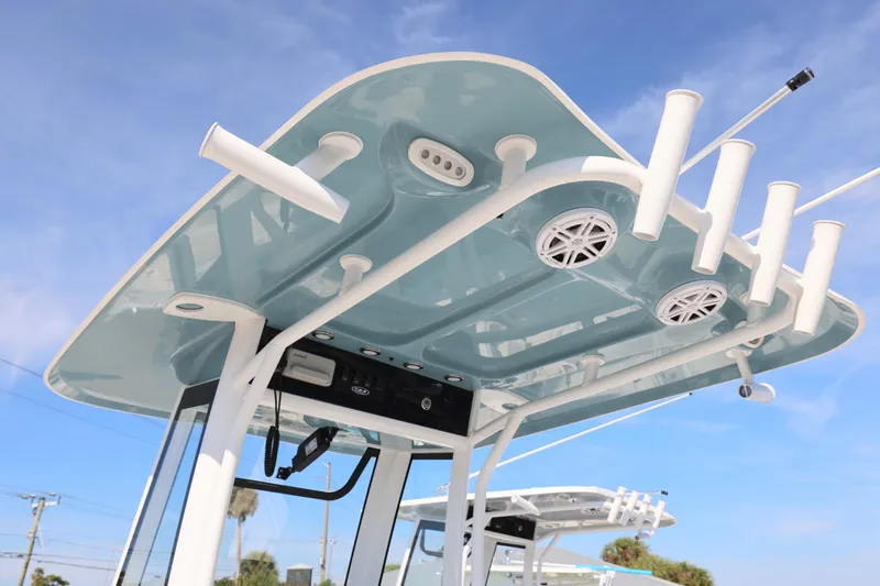 Slide: The Image of 2026 Sea Hunt Ultra 245 SE boat top with rod holders and speakers. - 18