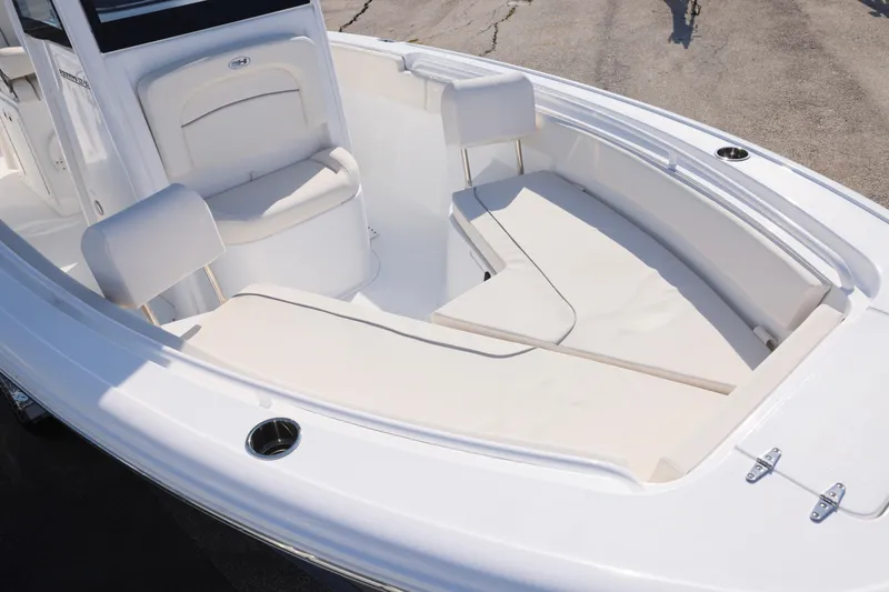Slide: The Image of 2026 Sea Hunt Ultra 245 SE boat interior with cushioned seating and sleek design. - 3