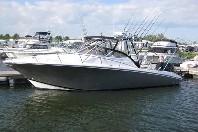 Slide: The Image of 2007 Fountain 33 Sportfish Cruiser interior with kitchenette and seating area. - 10