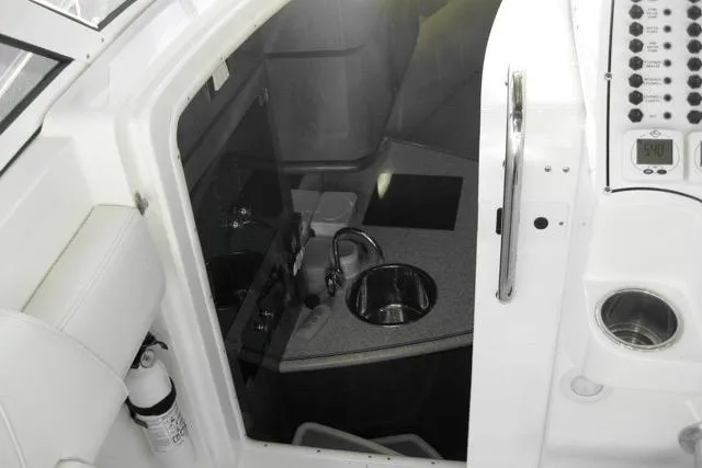 Slide: The Image of 2007 Fountain 33 Sportfish Cruiser in a garage with dual Mercury outboard engines. - 13