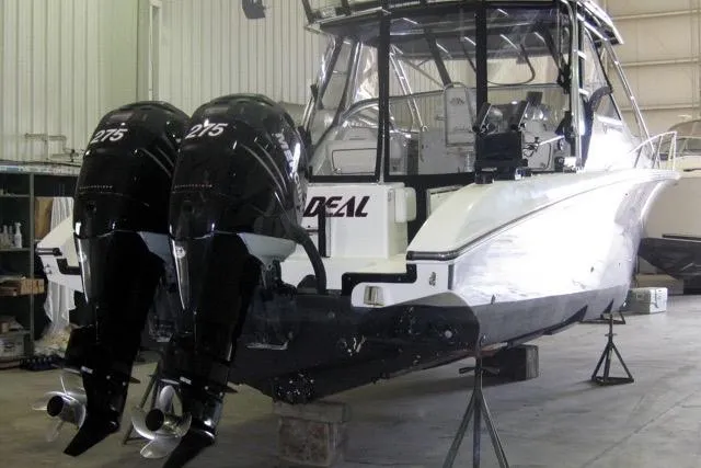 Slide: The Image of 2007 Fountain 33 Sportfish Cruiser lifted by a boat hoist at a marina. - 16