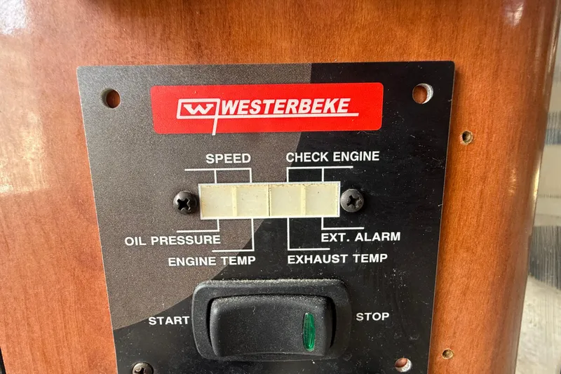 Slide: The Image of Westerbeke control panel on 2007 Fountain 33 Sportfish Cruiser, featuring engine indicators and switches. - 24