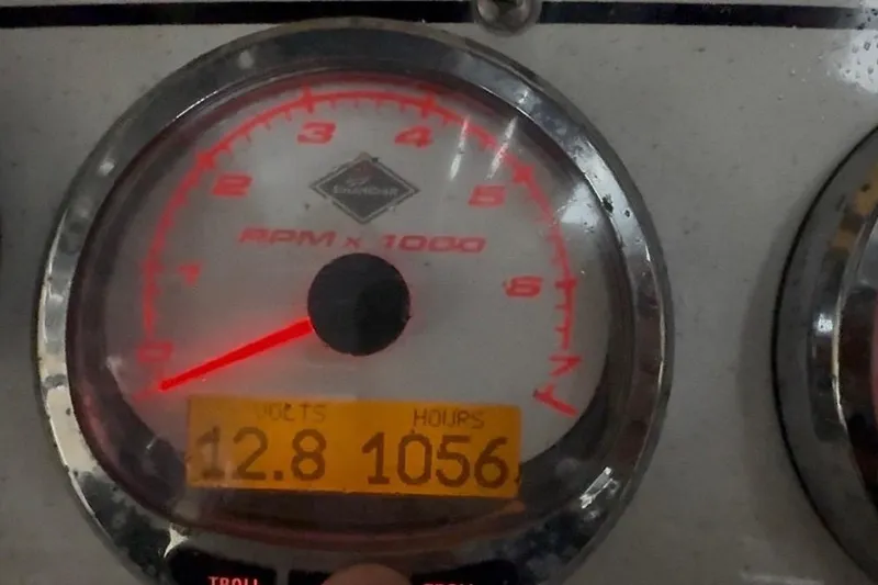 Slide: The Image of Close-up of 2007 Fountain 33 Sportfish Cruiser tachometer showing 12.8 volts and 1056 hours. - 28
