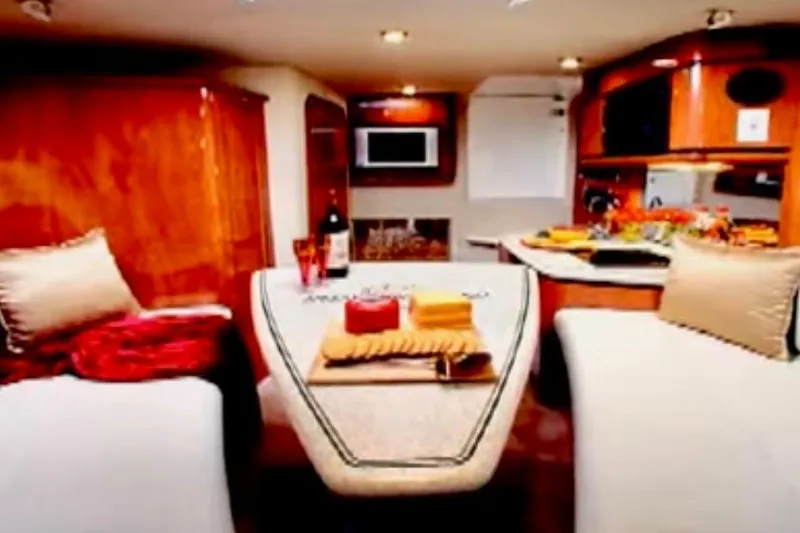 Slide: The Image of Gauge display showing 13 volts and 843 hours on a 2007 Fountain 33 Sportfish Cruiser. - 4