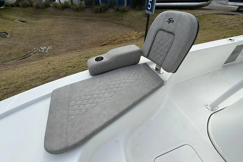 Slide: The Image of 2021 Sea Pro 248 Bay boat seat with gray upholstery and cup holder. - 11