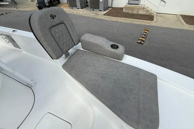 Slide: The Image of Gray seating on 2021 Sea Pro 248 Bay boat, featuring diamond-pattern upholstery and cup holder. - 13