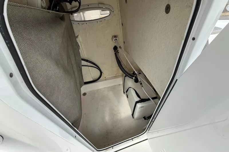 Slide: The Image of Interior view of 2021 Sea Pro 248 Bay boat storage compartment. - 16