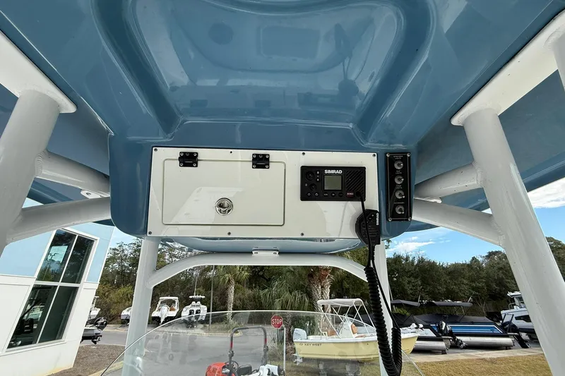 Slide: The Image of 2021 Sea Pro 248 Bay boat console with Simrad electronics and storage compartment. - 20