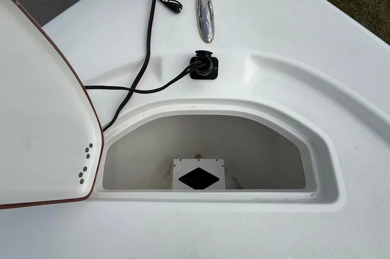 Slide: The Image of Open storage compartment on 2021 Sea Pro 248 Bay boat deck. - 8