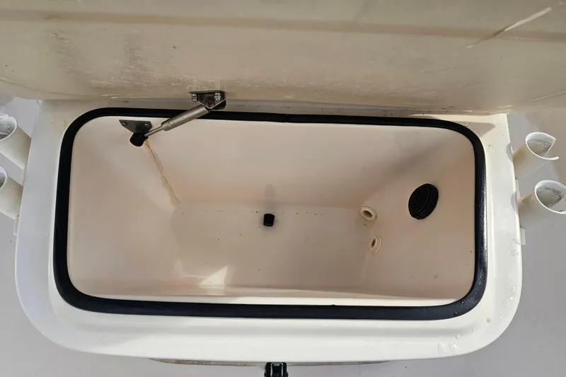 Slide: The Image of Open storage compartment on a 2001 Grady-White Sportsman 180 boat. - 17