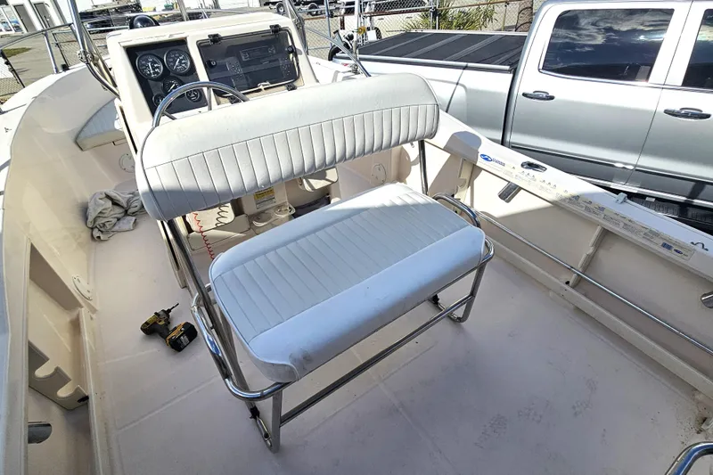 Slide: The Image of 2001 Grady-White Sportsman 180 boat interior with steering console and seating. - 19