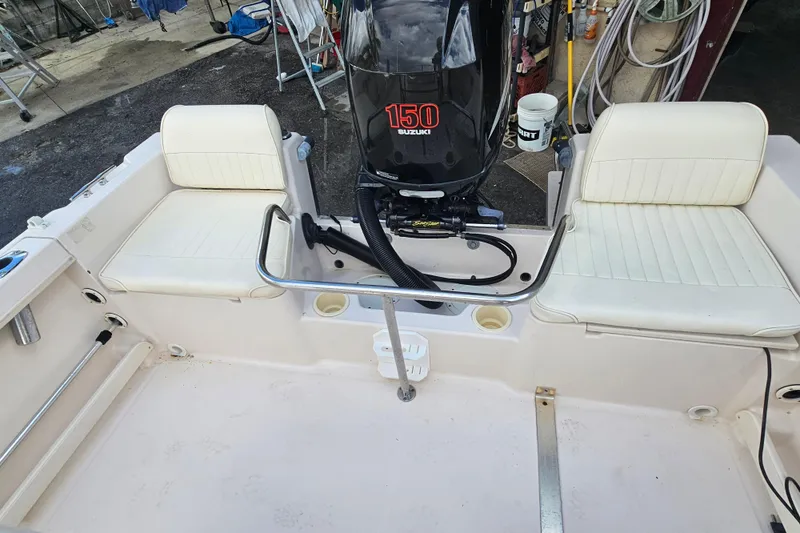 Slide: The Image of 2001 Grady-White Sportsman 180 boat interior with Suzuki 150 engine. - 20