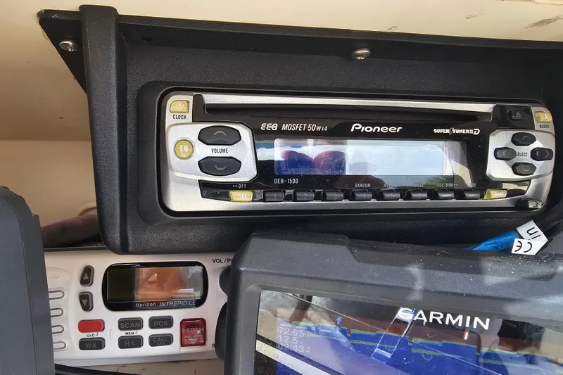 Slide: The Image of Pioneer stereo system on a 2001 Grady-White Sportsman 180 boat dashboard. - 24