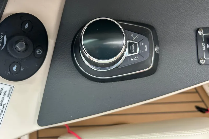 Slide: The Image of Control panel of a 2022 Boston Whaler 320 Vantage boat, featuring joystick and buttons. - 3