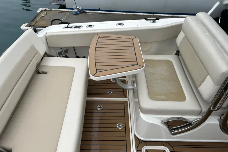 Slide: The Image of Boston Whaler 320 Vantage 2022 boat interior with seating and table. - 6