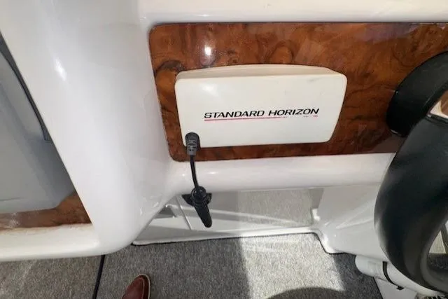 Slide: The Image of 1994 Sunseeker Apache 45 boat dashboard with Standard Horizon equipment. - 11