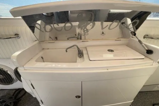 Slide: The Image of 1994 Sunseeker Apache 45 yacht interior with sink and storage area. - 12