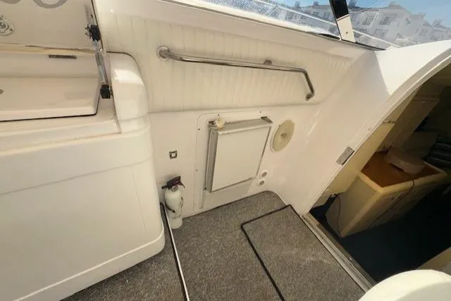 Slide: The Image of Interior view of 1994 Sunseeker Apache 45 yacht, featuring a compact cabin area. - 13