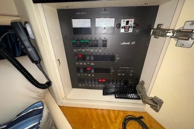 Slide: The Image of Electrical control panel of 1994 Sunseeker Apache 45 yacht, featuring switches and meters. - 15