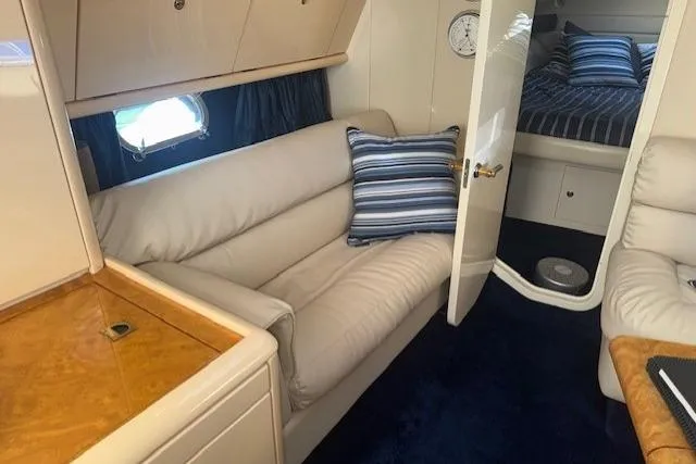 Slide: The Image of Luxurious interior of 1994 Sunseeker Apache 45 yacht with plush seating and elegant decor. - 25