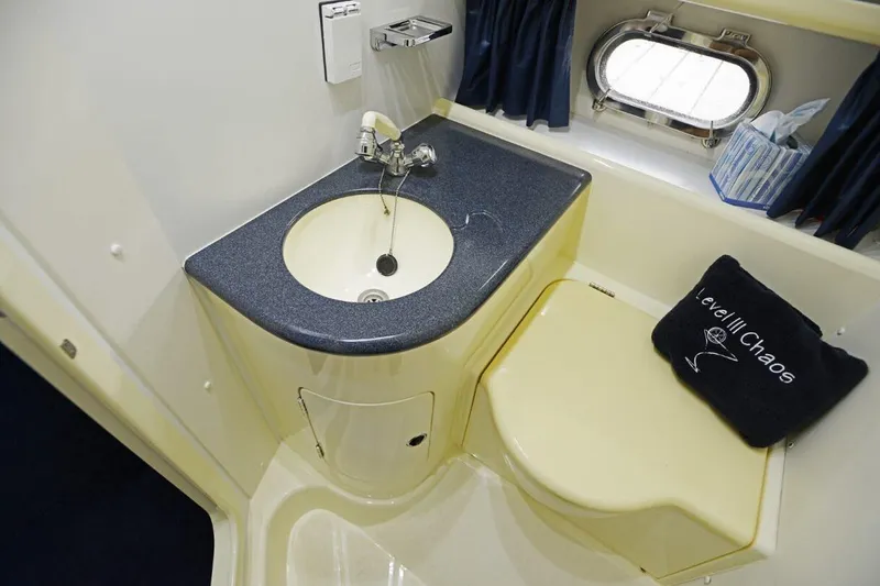 Slide: The Image of Bathroom interior of 1994 Sunseeker Apache 45 yacht with sink and porthole window. - 27