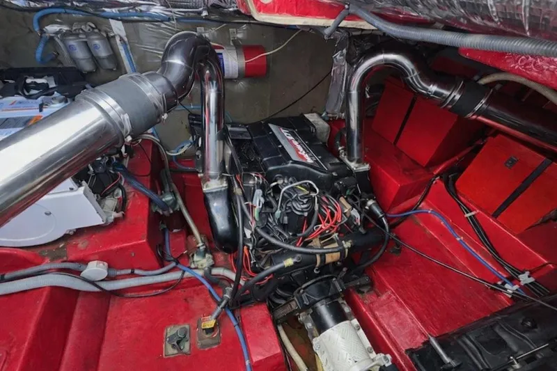 Slide: The Image of Engine room of a 1994 Sunseeker Apache 45, featuring red components and wiring. - 28