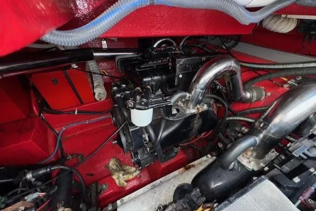 Slide: The Image of Engine compartment of a 1994 Sunseeker Apache 45, showcasing mechanical components and wiring. - 29
