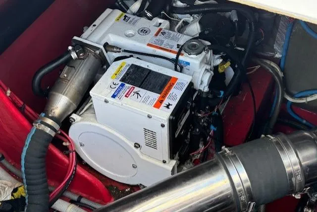 Slide: The Image of Engine compartment of a 1994 Sunseeker Apache 45 boat, showcasing mechanical components. - 30