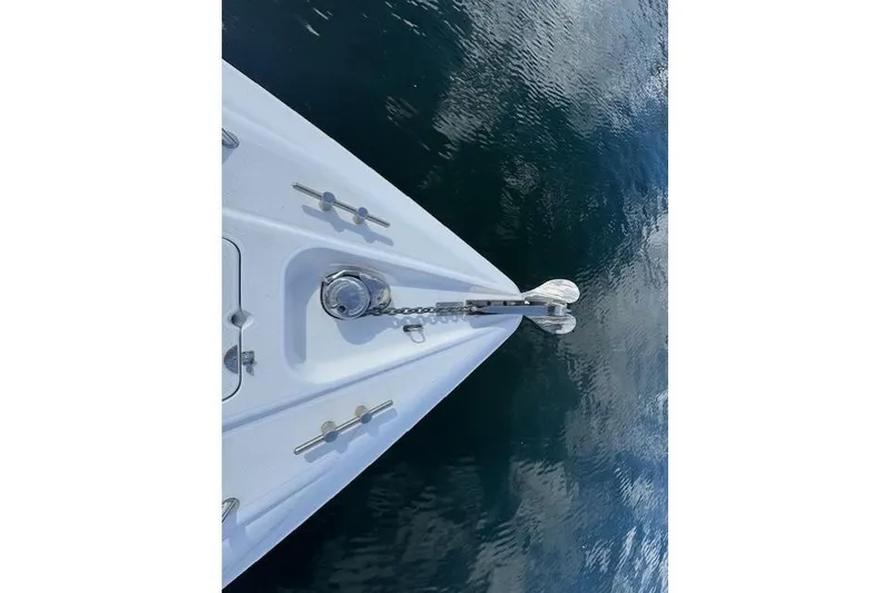 Slide: The Image of Bow of 1994 Sunseeker Apache 45 yacht with anchor over calm water. - 32